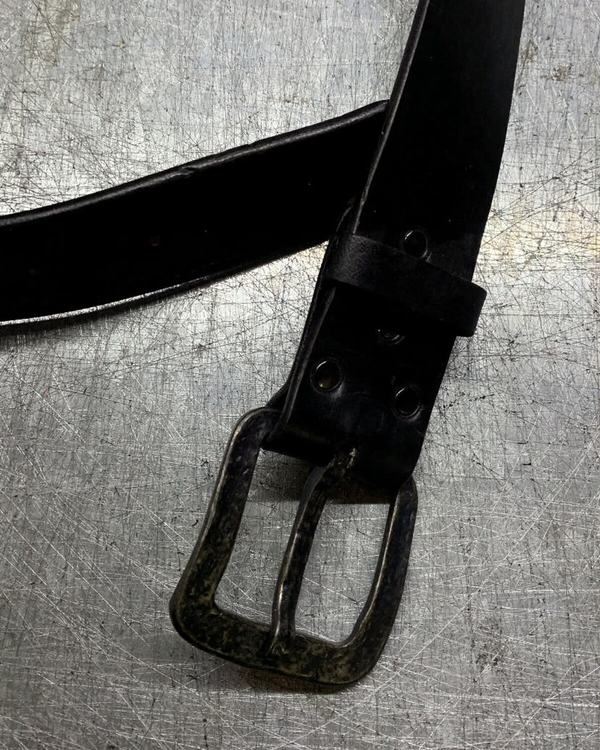 Aevum leather belt buckle attachment and keeper detail