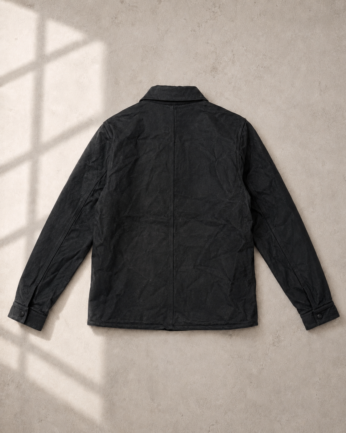 Back of Handmade Utilitarian Leather Jacket with single cuff snap