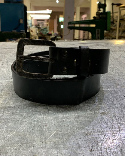 Aevum leather belt photographed in the León workshop