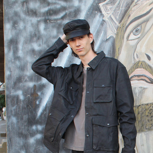 Close-up of the Imminent Occurrence Fiddler Hat worn in black leather