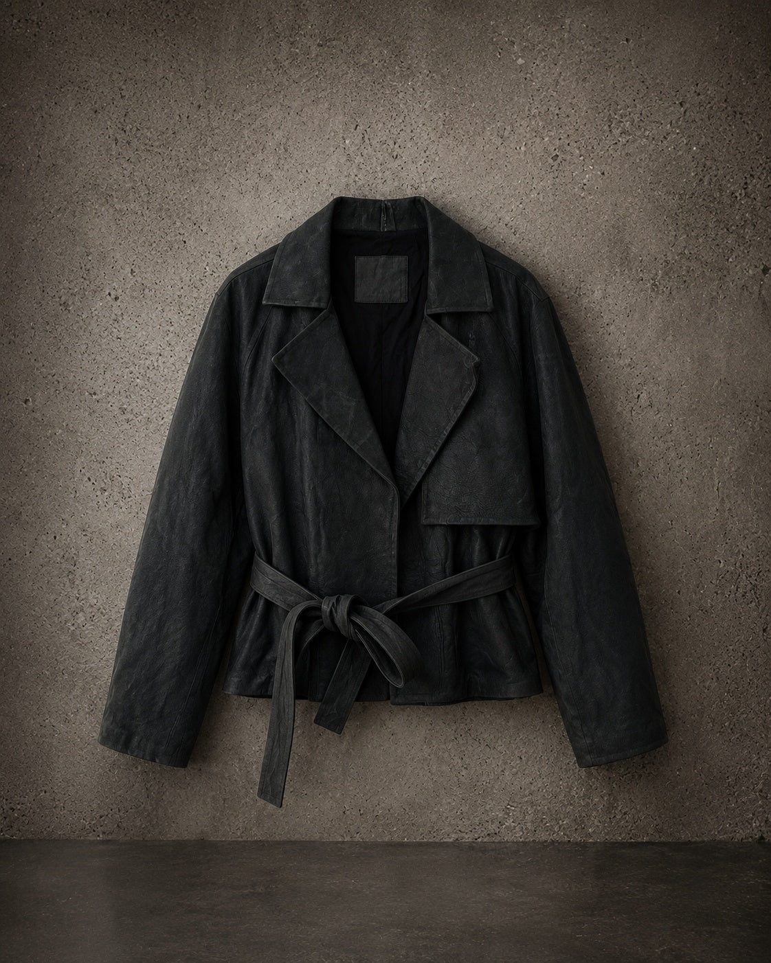 Handmade Leather Trench Jacket front hanging view on IO industrial concrete backdrop