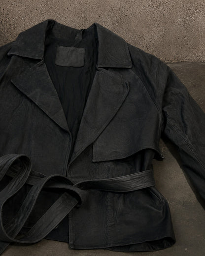 Handmade Leather Trench Jacket lapel and belt detail on IO industrial concrete backdrop