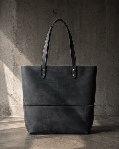 Imminent Occurrence leather tote bag in dry charcoal black leather, front view