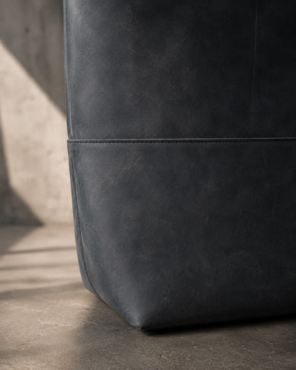 Close up of dry gray charcoal leather texture on Imminent Occurrence tote bag
