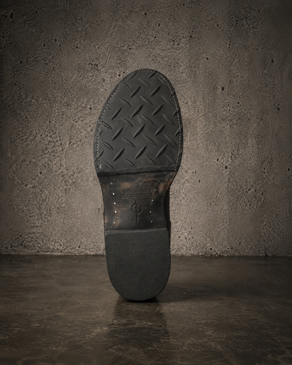 IO Engineer Boot sole with embossed Imminent Occurrence stamp detail